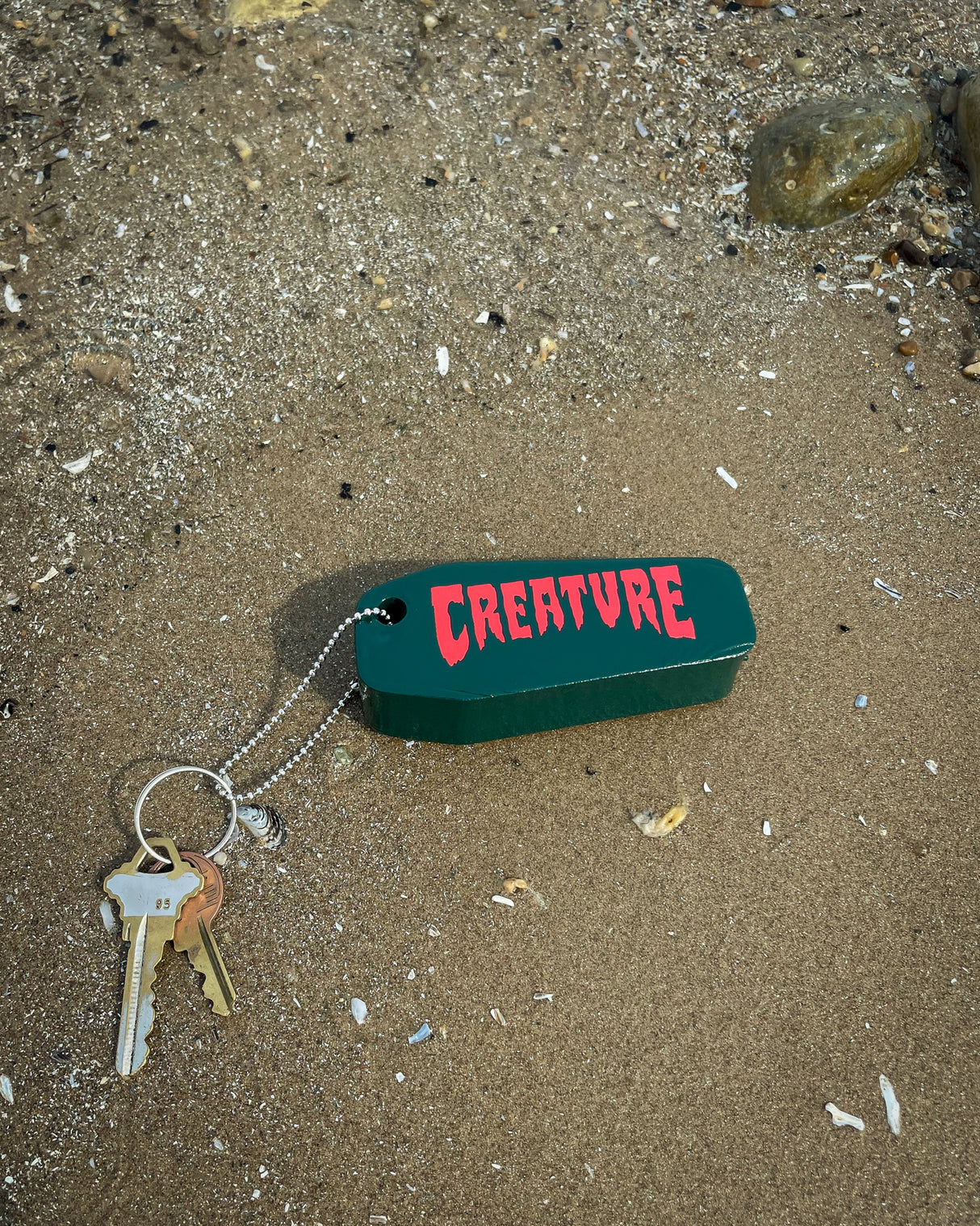 Creature Lost At Sea Dark Green Floatie Key Chain